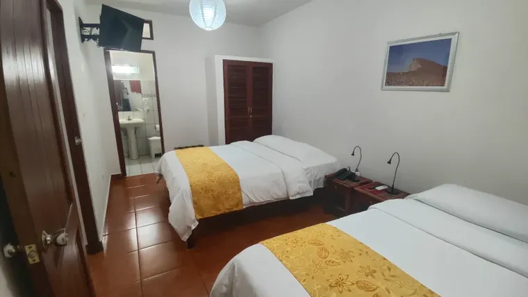 El dormitorio con dos camas Queen de los apartamentos 5-8 