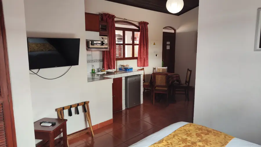 The kitchenette in room 2, with microwave and tableware for four